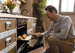 medium-shot-man-holding-tray-with-croissants